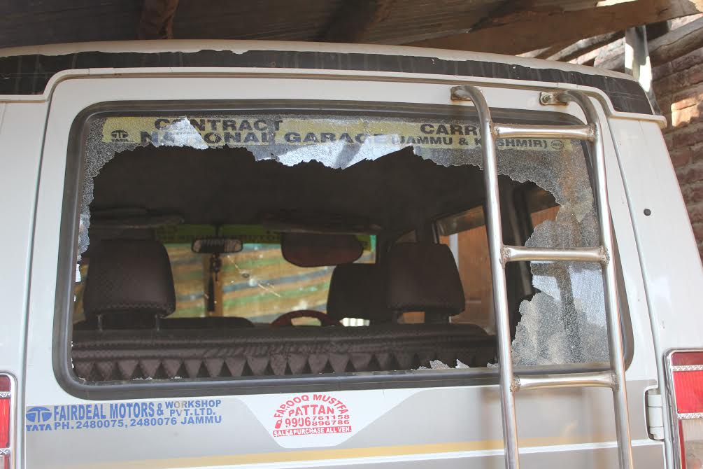 A privately owned passenger Sumo damaged allegedly by forces in Kuensoo village on Oct 25, 2016. (KL Image: Mohammad Abu Bakar)