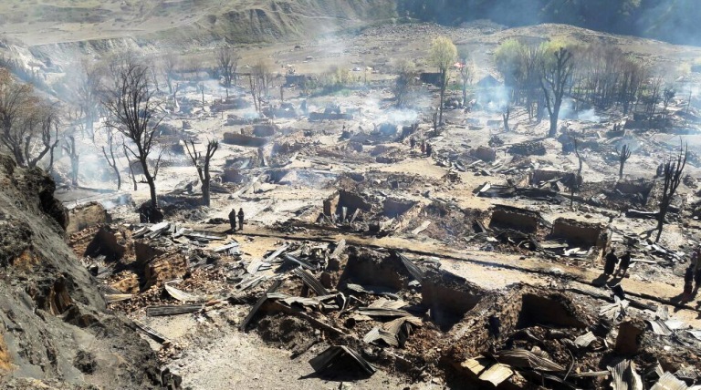 Remains of the Warwan village Sukhnai that was smouldering on October 16, 2016 after almost 20 hours of the fire