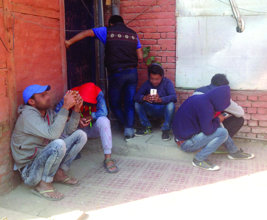 Boys using wifi in Press Colony.