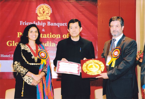 Dr Syed Basharat Shah receiving award in Thailand.  
