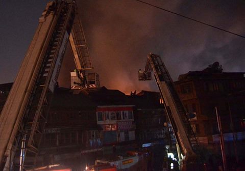 Fire fighters dousing fire at Saraibala Srinagar on Nov 11, 2016 (KL Image: Bilal Bahadur)