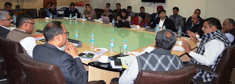 B B Vyas presiding over a meeting about World Bank project
