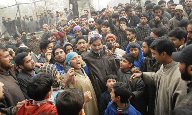 JKLFs Yasin Malik with residents in Tral outside Burhan Wani's cemetry