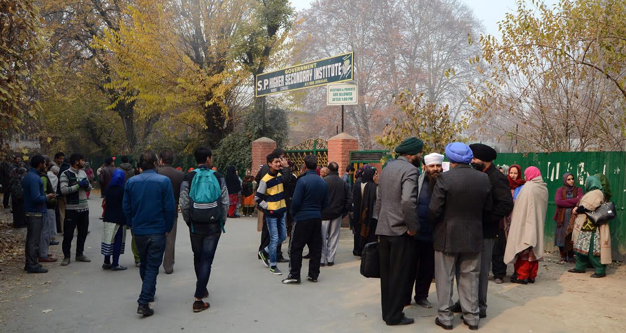 Students outside an examination centre in Srinagar's SP Higher Secondary School. KL Image by Bilal Bhadur