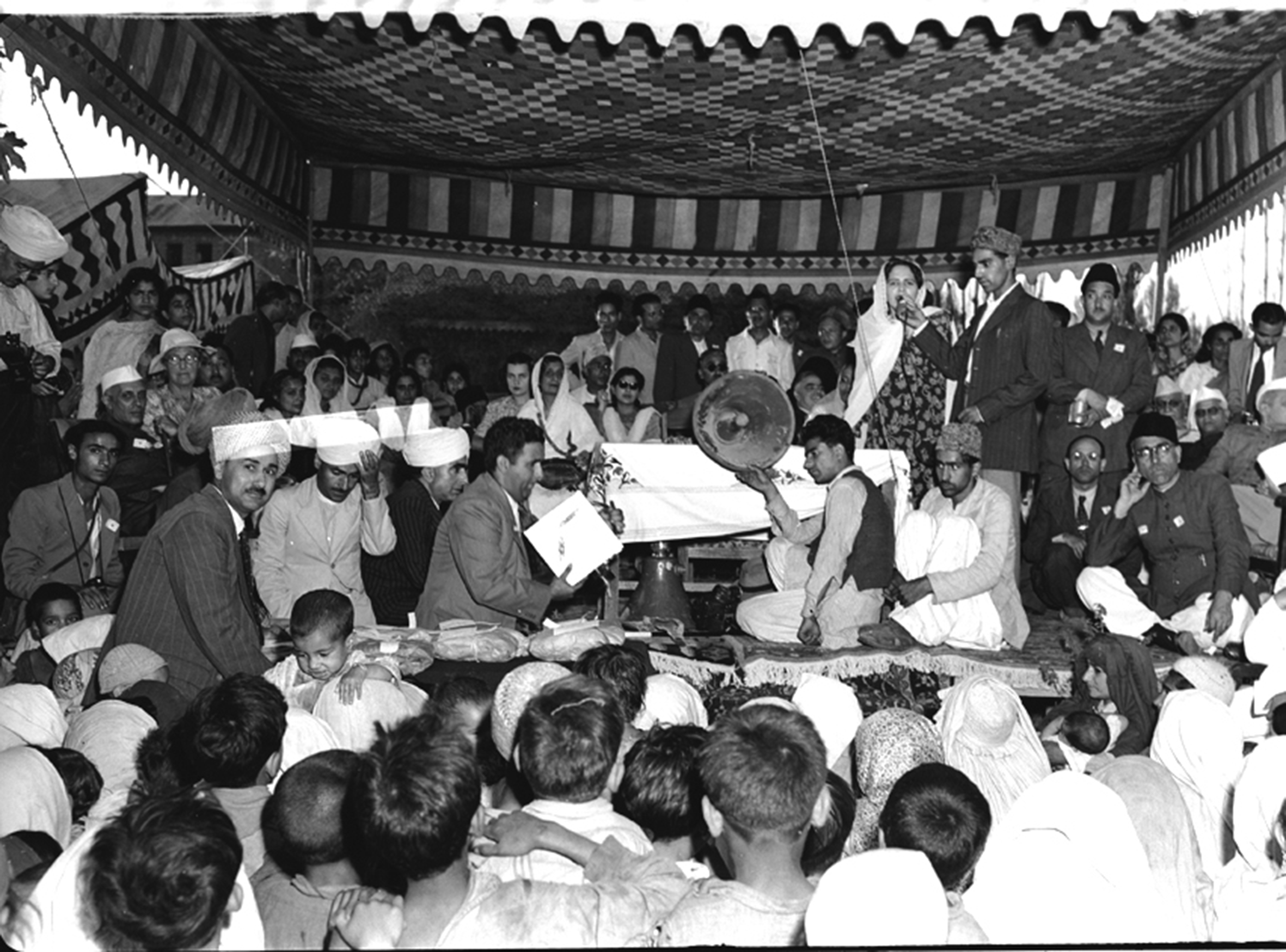 The government organised a baby show on September 25, 1949 to provide entertainment to the delegates who were in Srinagar to attend annual session of NC. While a woman is making a speech, those listening include Pandit Nehru, Rajkumari Amrit Kaur NV Gadgil & Sheikh Muhammad Abdullah