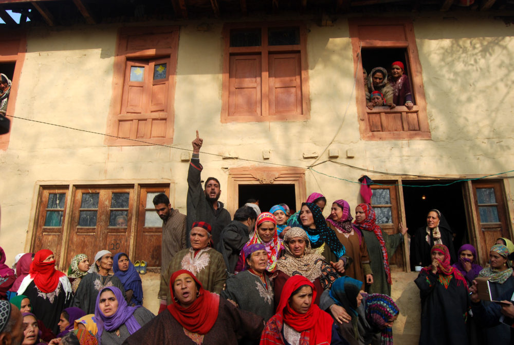 Mourners at Sajad's home. 
