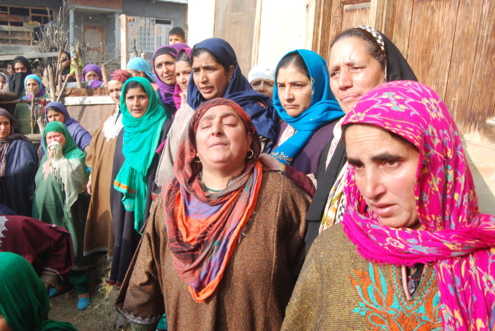 Mourners at Sajad's home. 