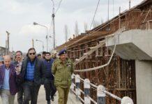 Div Com tours city, reviews pace of ongoing developmental projects
