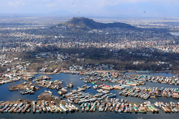 An aerial view of Srinagar city including parts of world famous Dal lake in Srinagar on Wednesday, as sun came out for the first time this week afrer rains lashed Kashmir valley and snow on the hills. The sun brought respite to the people from the cold wave.
