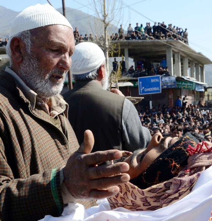Relatives wailing near the body of Omar Farooq, a 22-year-old youth who was killed in Baroosa village of Ganderbal District on Sunday, April 9 after clashes erupted when poling staff was attacked by locals pelting stones.    PHOTO BY BILAL BAHADUR