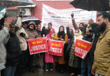 Amid snowfall, election department employees stage protest for fulfillment of pending demands
