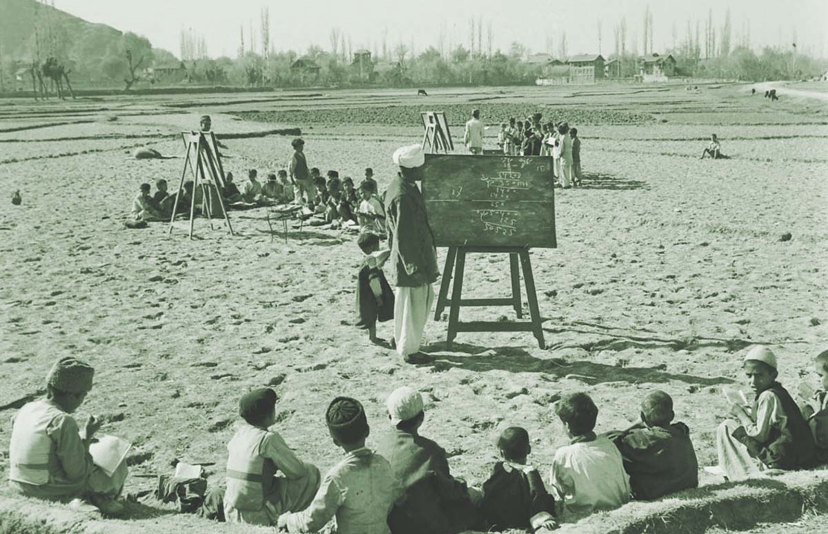 A 1955 photograph showing the students being taught in an open school.