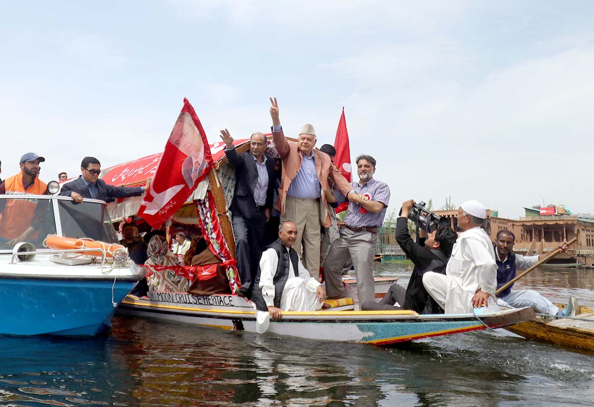 Dr Farooq Abdullah alongwith other party members during an election campaign in Dal Lake.