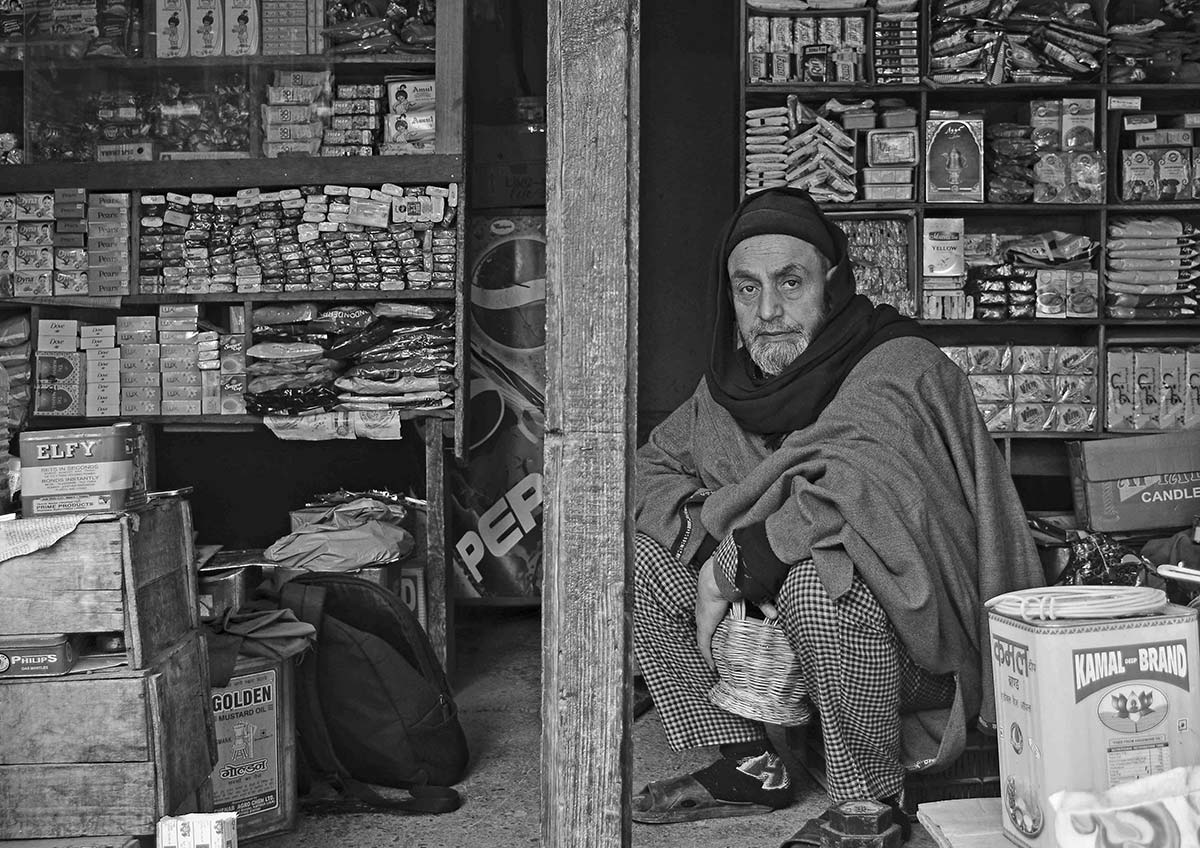 Ghulam Hassan Bangi at his shop. - Ruined Life - Kashmir Life - Story
