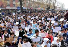 PHE casual labourers along with their children stage protest, demand release of pending wages