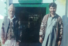 Bashir Ahmad with his father in this family photo.