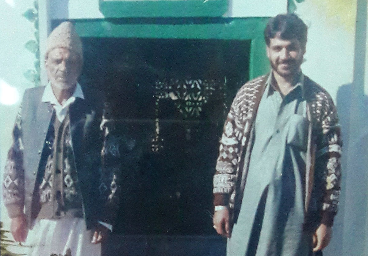 Bashir Ahmad with his father in this family photo.