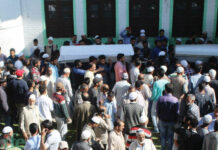 People carry bodies of three civilians during the funeral procession in Baramulla, on May 1, 2018. KL Image: Bilal Bahadur