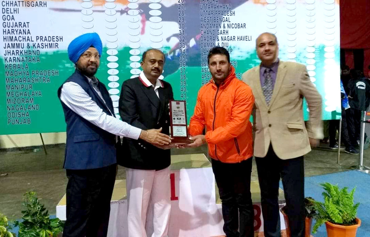 Nisar Ahmad Mir receiving  award at a National Level  Wushu  Competition.