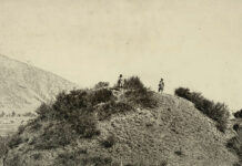 Photograph of a Buddhist stupa mound near Baramulla in Jammu and Kashmir, taken by John Burke in 1868. Buddhism was established in Kashmir from the third century BC but declined by the 8th century AD, eclipsed by Hindu Vaishnavism and Shaivism. Two of the most important sites for Buddhist remains in the Kashmir valley are Harwan near Srinagar and Ushkur near Baramulla.