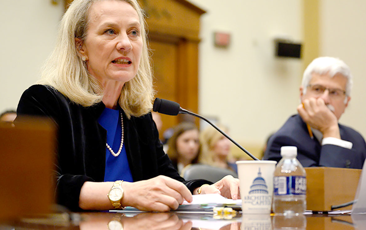 Alice G Wells, acting assistant secretary testifying before HFAC as her colleague Robert Destro is watching.