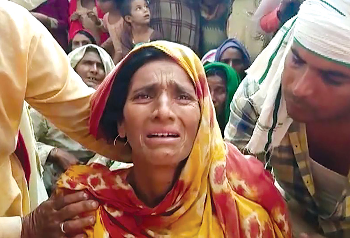 The family members of the slain driver mourning the killing in Rajasthan.