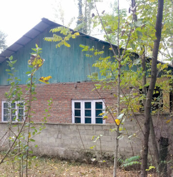 18 Years, Waiting A side view of a Panchayat building in Anzwalla village of Anantnag. KL Image by Umar Khurshid