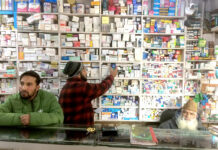Rehmani Sameer selling medicines at his brother’s chemist shop in Janglat Mandi Anantnag. KL Image by Umar Khurshid