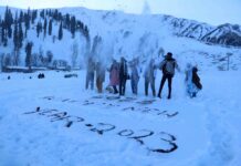 Year End 2022: Tourists playing with the famous powder snow in Gulmarg - the only place outside the Alps, at the year-end of 2022. The entire picnic spot is booked as visitors are enjoying parties and musical events. The year marks the historical tourist year given the record arrivals. KL Image: Bilal Bahadur Kashmir Life