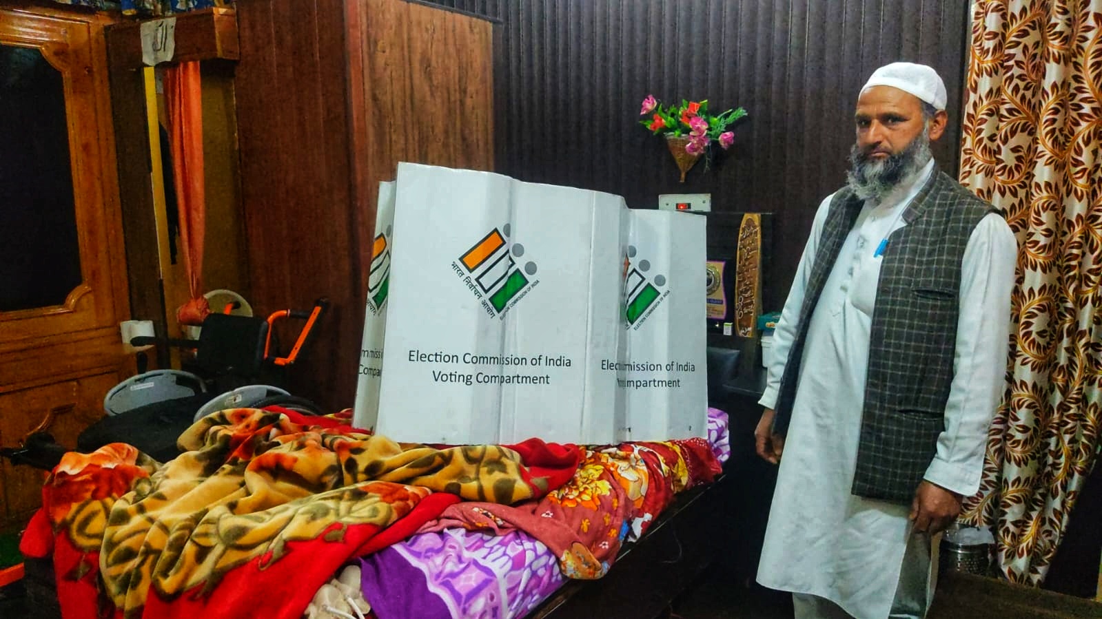 A man who was paralyzed in an accident in 2014 cast his vote via secret ballot in Doda district on April 14, 2024, participating in the Parliament elections. (KL image: Amir Tantray)