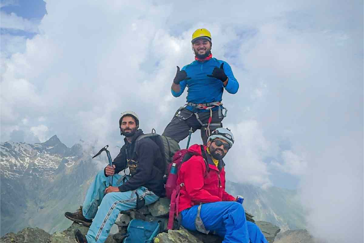 The expedition team celebrates on the summit of Mt Sekiwas after completing the first documented civilian climb of the peak in more than 80 years