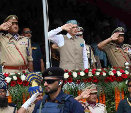 Omar Reaffirms Commitment To Jammu Kashmir Statehood, Constitutional Guarantees CM Omar Abdullah unfurls the Tricolor during August 15 function at Bakshi Stadium, in Srinagar, Saturday, August 15, 2026. KL Image by Bilal Bahadur