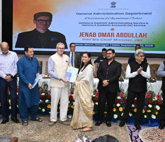 Chief Minister Omar Abdullah hands over an appointment order to a newly appointed officer during a function at SKICC in Srinagar on September 15, 2026.