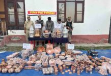 Police display the copper utensils recovered during the investigation into a theft case registered at Pattan in Baramulla